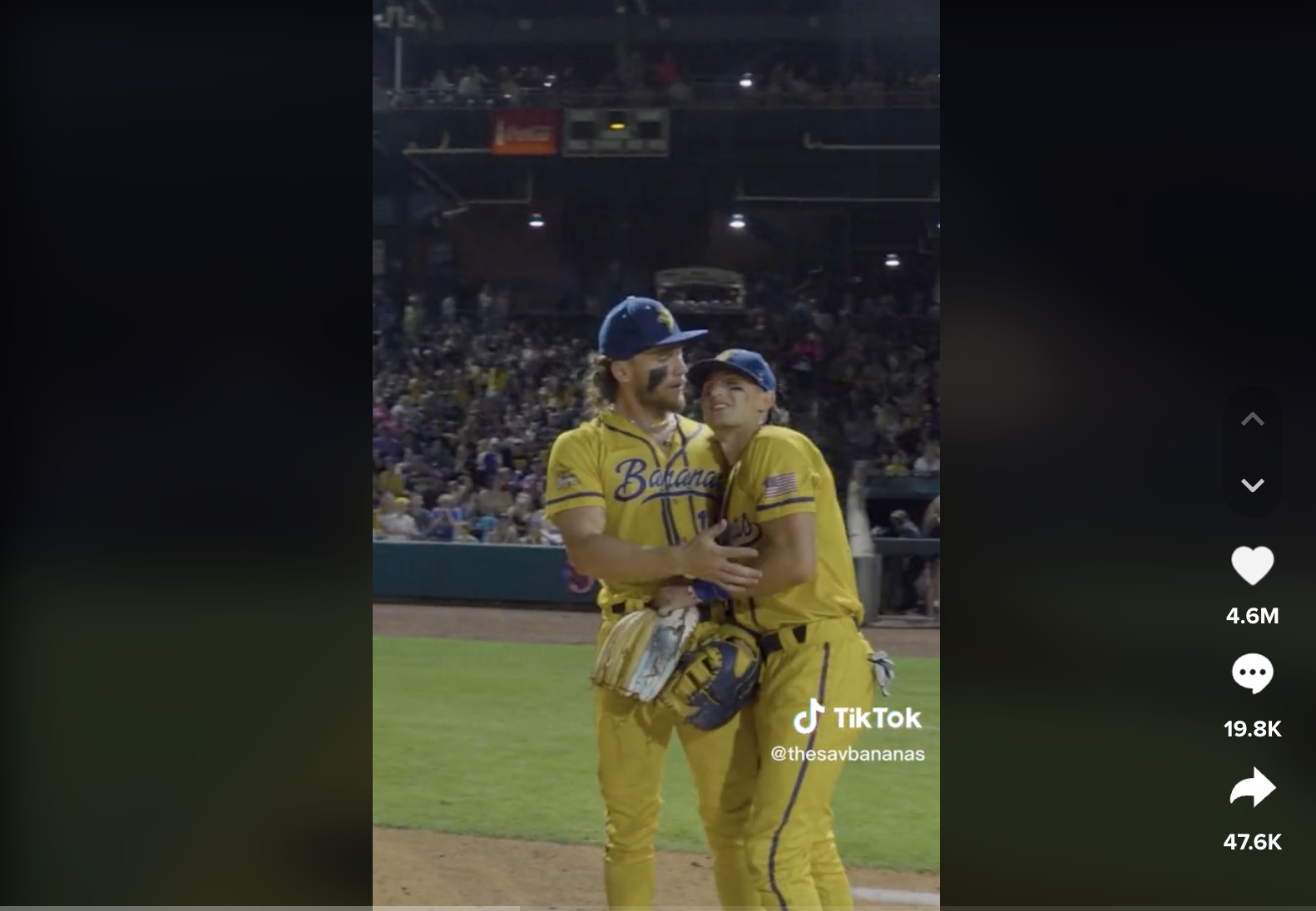 Screenshot of two savannah bananas players hugging