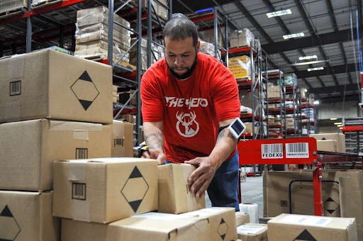 A photo of a worker organising inventory at Red Stag Fulfillment
