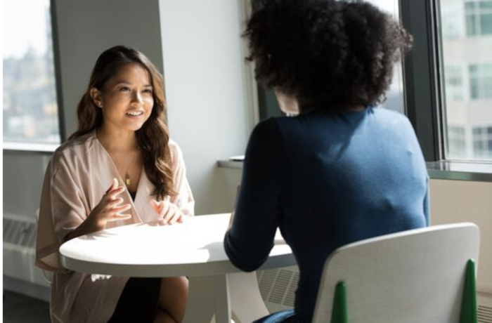 Social media manager interview questions stock image of women speaking